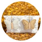 Warm vlindertje zand en wit