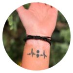 Armband gevlochten met vlinder