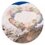 Armband in pastel met vlindertje