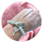 Parelarmband met voetje en sleutel