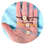 Set vier veterarmbandjes met bloem